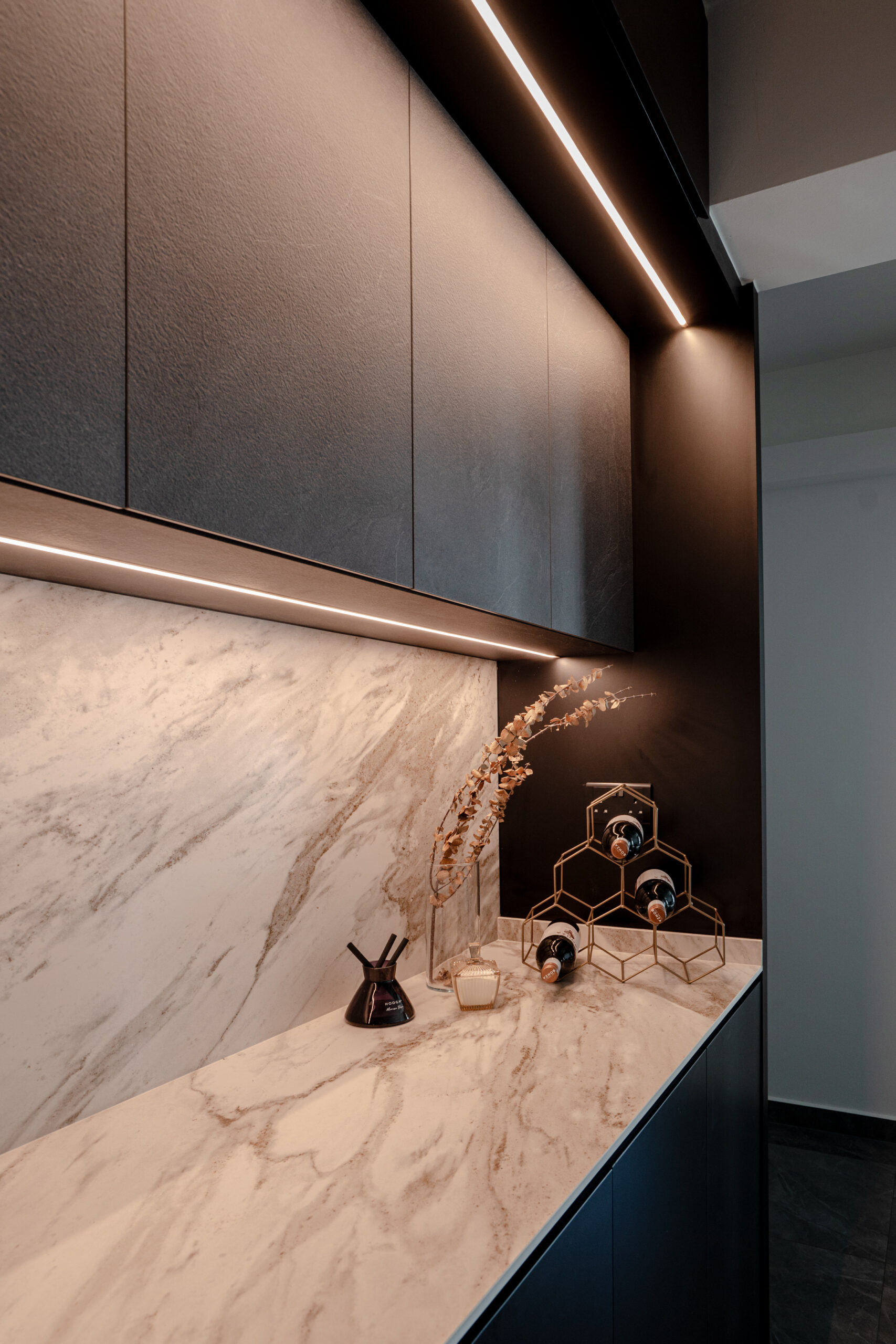 Contemporary HDB home project featuring sleek black cabinets and luxurious marble sintered stone surfaces